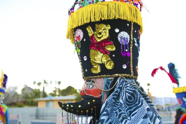 A sequenced Winnie the Pooh decorates the side of this traditional Morelos, Mexico Chinelo, dancer, mask, Tuesday, Jan. 8, 2013. The "Comparza Morelense," a local Las Vegas cultural dance troupe, has been invited to perform at President Obama's inauguration parade on January 21.